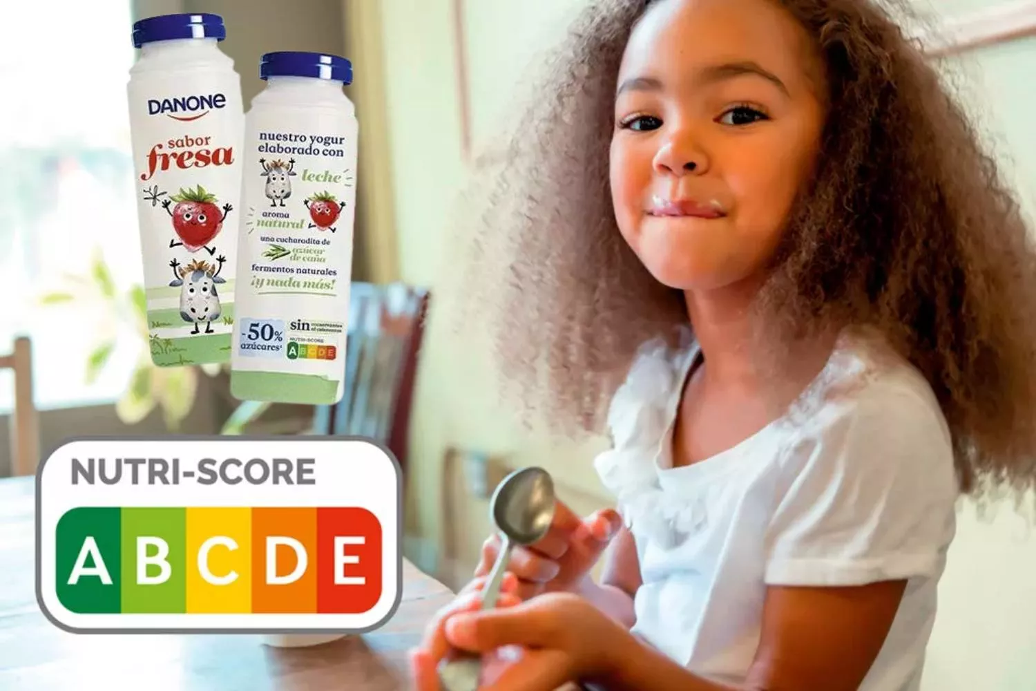 Uma imagem promocional de Nutriscore ao lado de um iogurte Danone com o semáforo nutricional / CG PHOTOMONTAGE