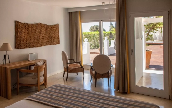 Una de las habitaciones / PARAISO DE LOS PINOS