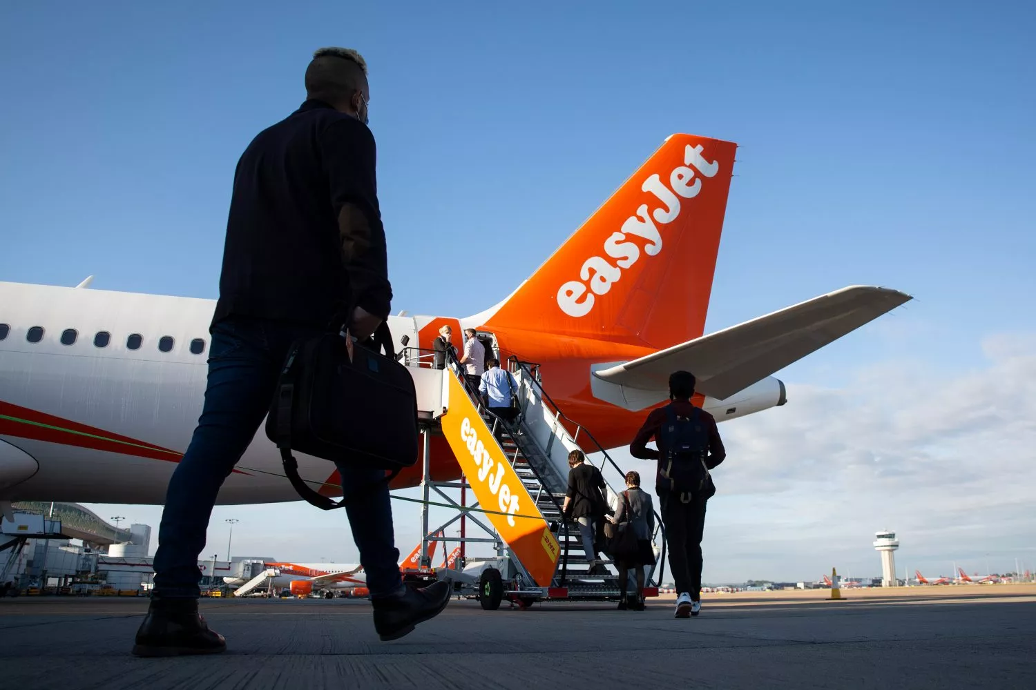 Unas personas regresan a casa en un avión de EasyJet / Matt Alexander - EP Unas personas regresan a casa en un avión de EasyJet / Matt Alexander - EP