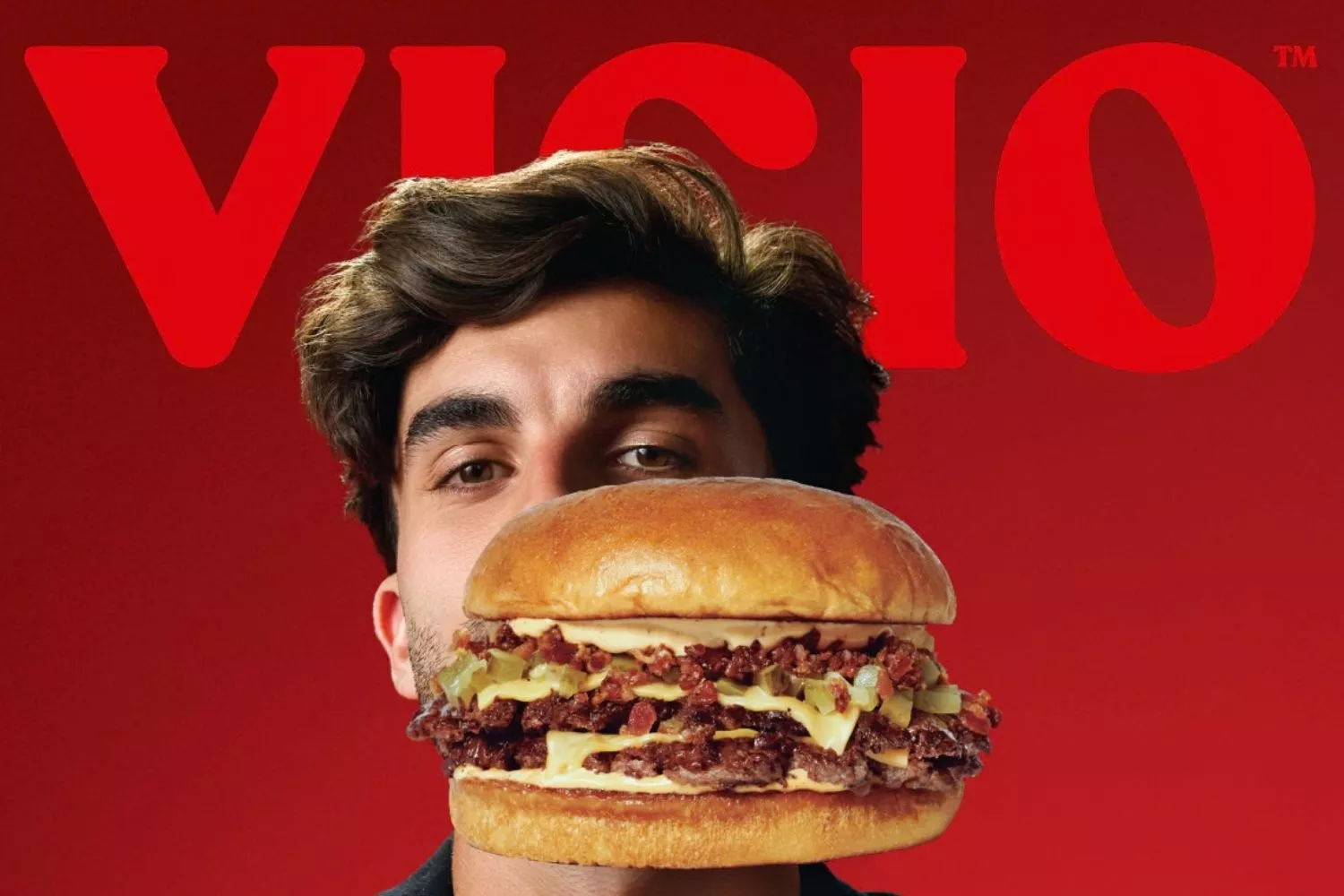 Cartel promocional de Vicio con una hamburguesa y Ferran Torres / VICIO